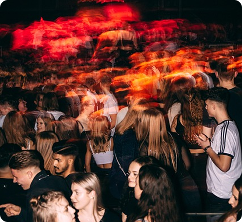 Concert crowd with red lighting